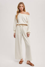 OFF THE SHOULDER JUMPSUIT: