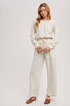 OFF THE SHOULDER JUMPSUIT: